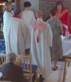 Bishop Hart ordaining a priest